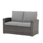 Salon de jardin en rotin pour 4 personnes avec coussins gris et table en verre trempé