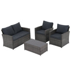 Salon de jardin en rotin pour 4 personnes avec coussins gris et table en verre trempé