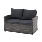 Salon de jardin en rotin pour 4 personnes avec coussins gris et table en verre trempé