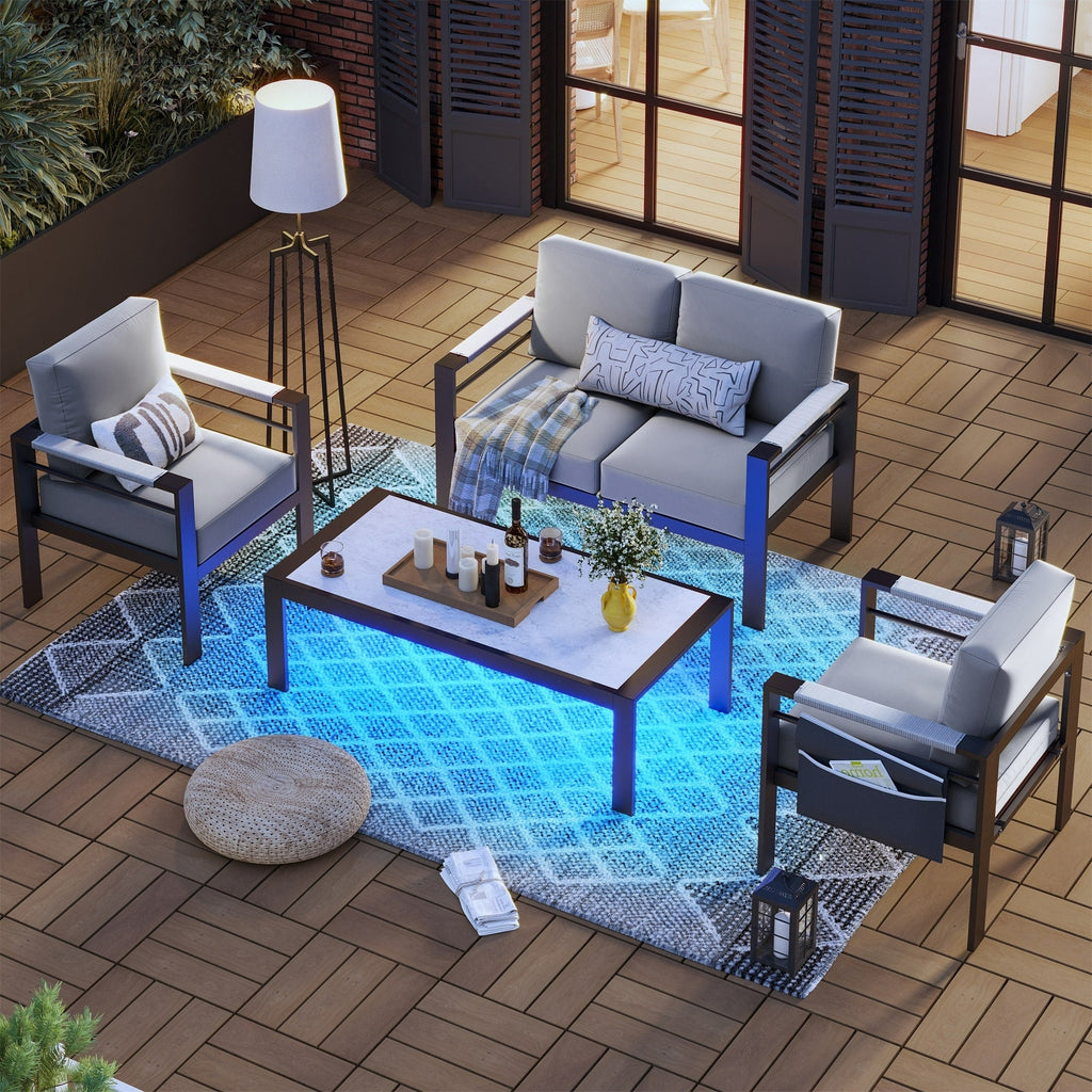 Ensemble de salon de jardin 4 pièces en aluminium pour 4 personnes avec coussins, table basse à LED et causeuse