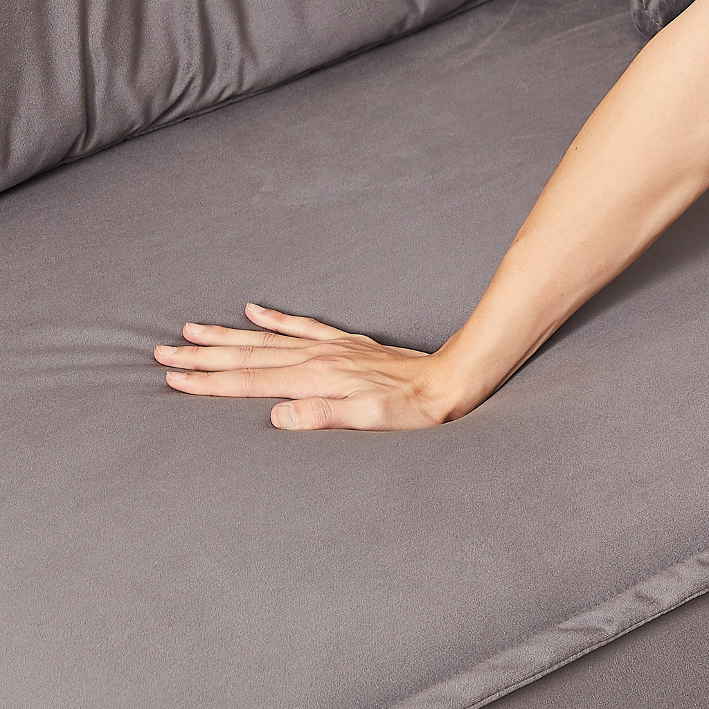 Canapé inclinable 3 places en velours avec 2 coussins, structure en bois massif et ressorts sinueux.