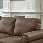 Canapé 3 places en cuir véritable aspect peau de vache avec garniture cloutée, revêtement en similicuir résistant.