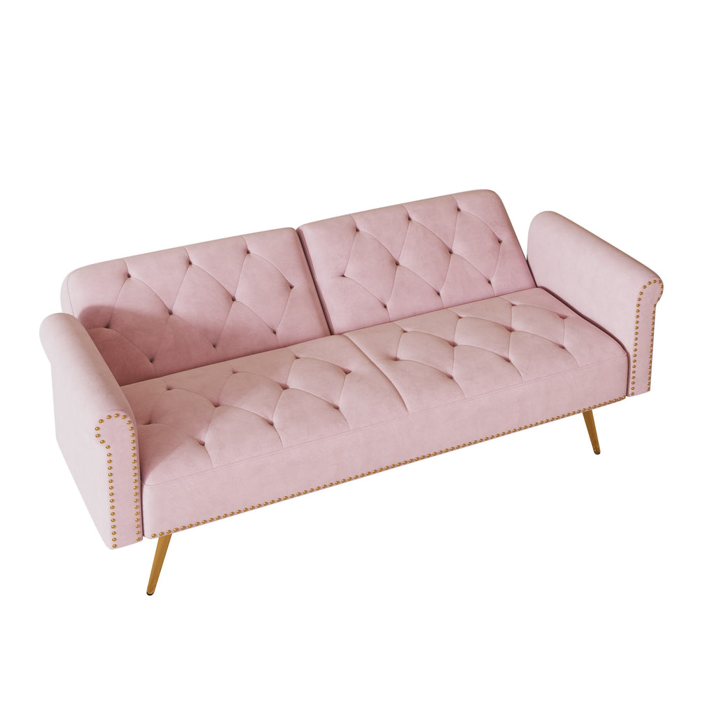 Un canapé-lit de 176 cm de long recouvert de velours, orné d'une bordure cloutée et accompagné d'un coussin assorti.