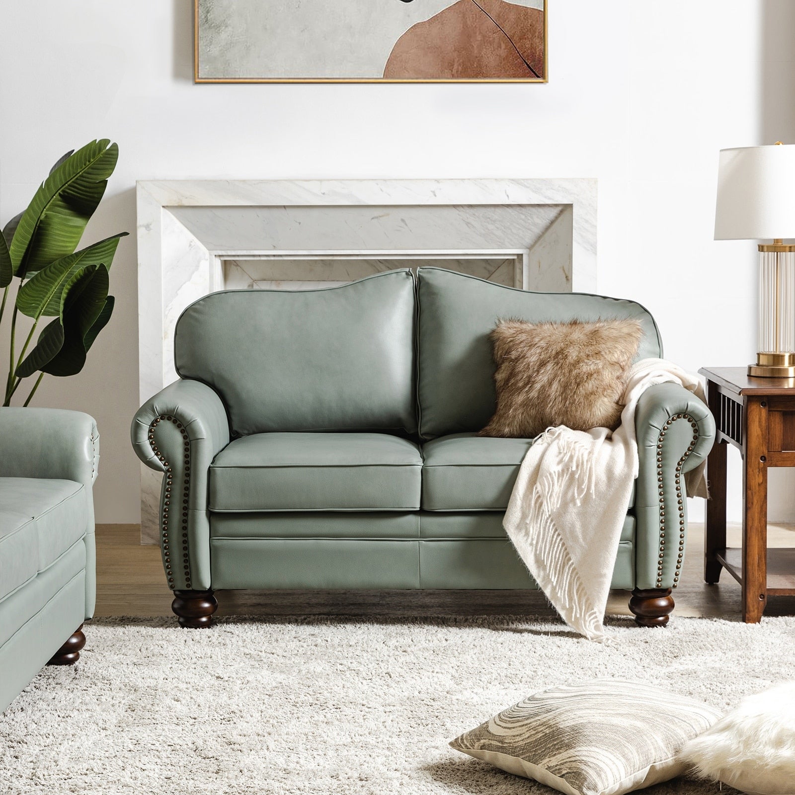 Canapé transitionnel Angel en cuir véritable avec dossier capitonné par HULALA HOME