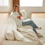 Canapé 3 places en chenille beige avec coussins supplémentaires