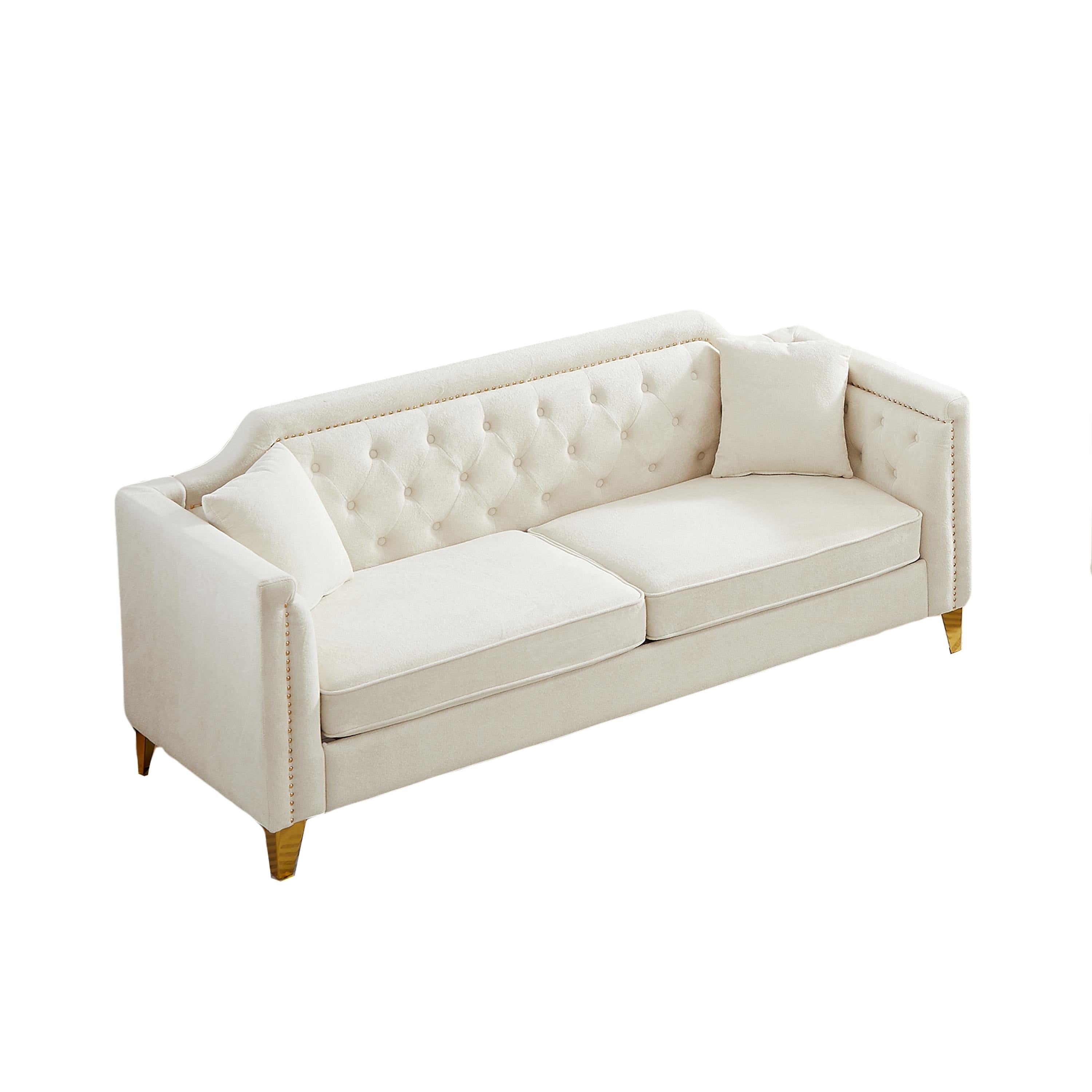 Canapé 3 places capitonné en chenille beige avec décoration cloutée en cuivre