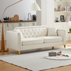 Canapé 3 places capitonné en chenille beige avec décoration cloutée en cuivre