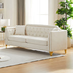 Canapé 3 places capitonné en chenille beige avec décoration cloutée en cuivre
