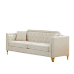 Canapé 3 places capitonné en chenille beige avec décoration cloutée en cuivre