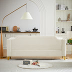 Canapé 3 places capitonné en chenille beige avec décoration cloutée en cuivre