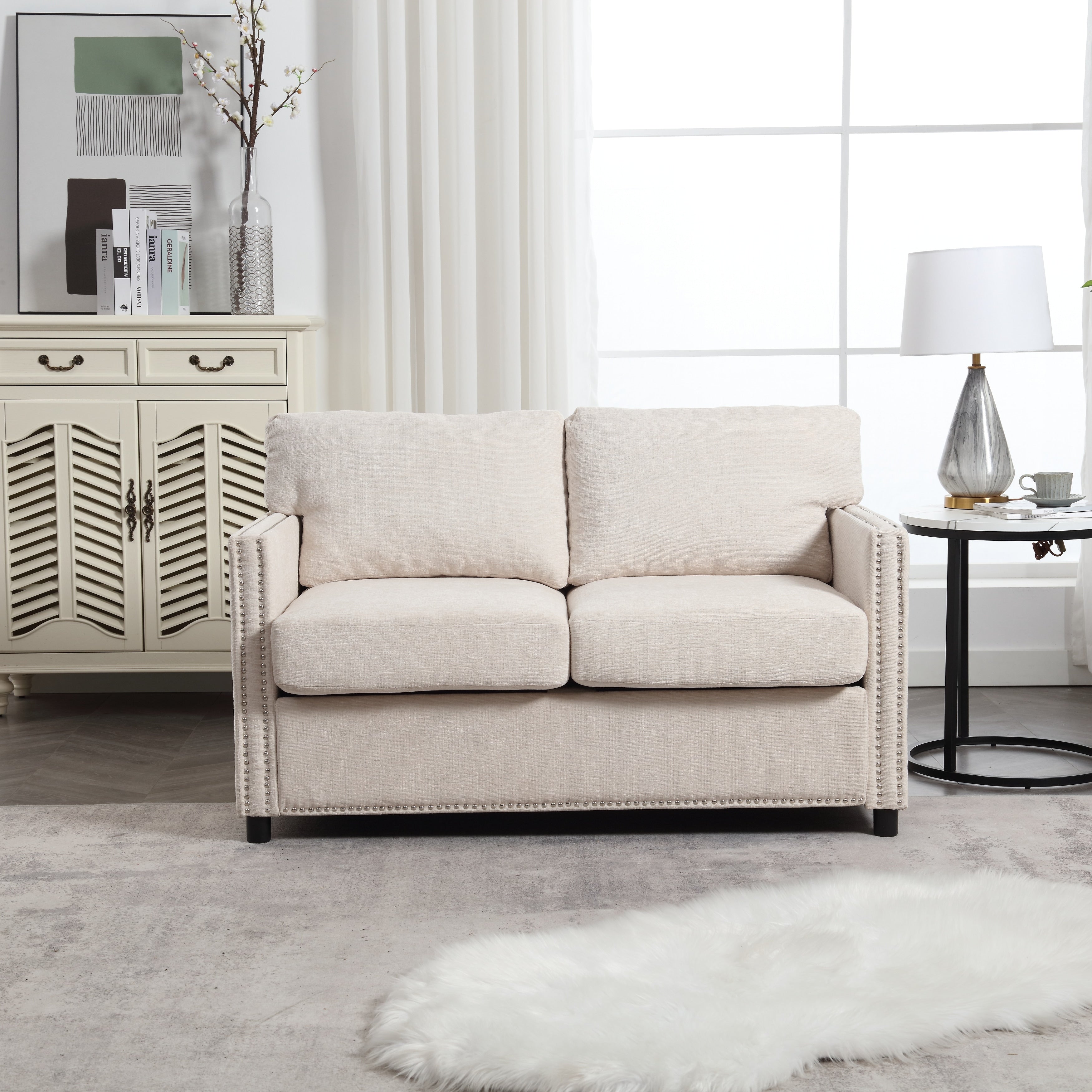 Canapé causeuse en chenille beige avec poche et clous décoratifs