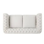 Canapé Chesterfield beige capitonné à boutons avec têtes de clous