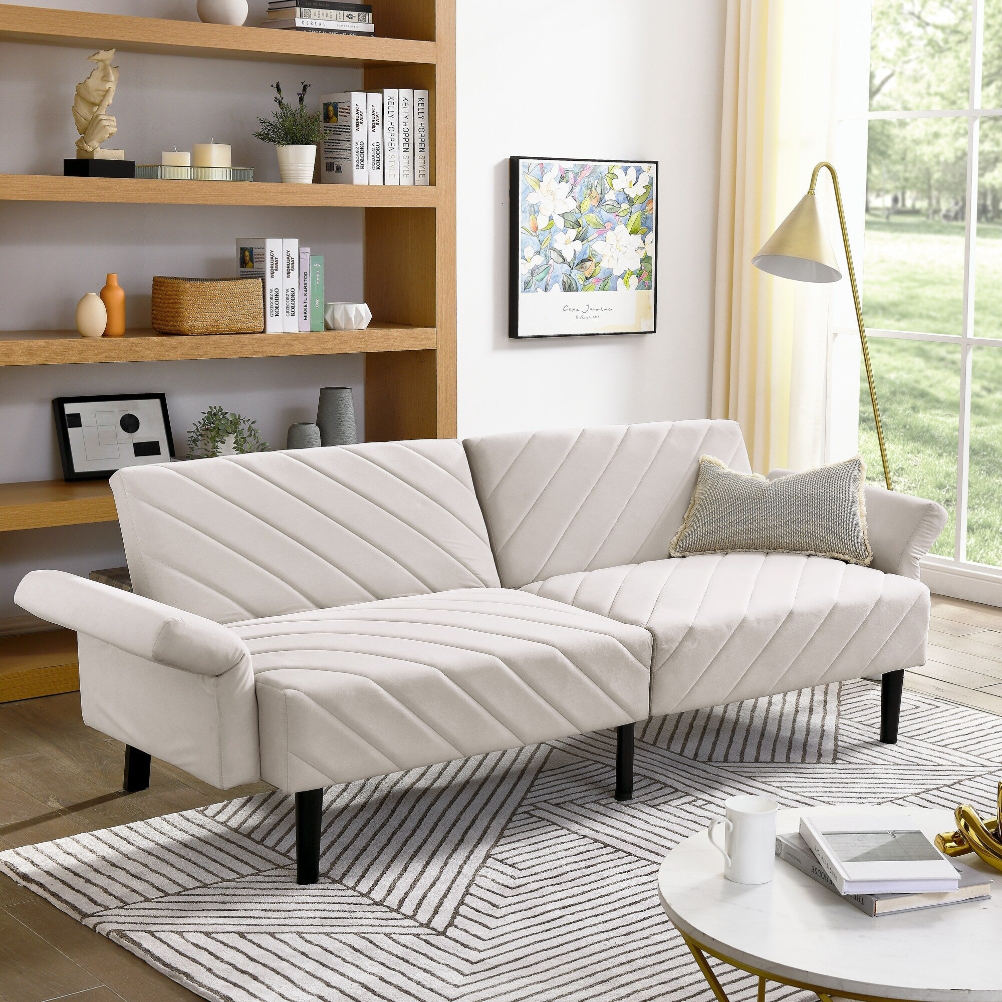 Canapé-lit futon convertible capitonné en velours beige