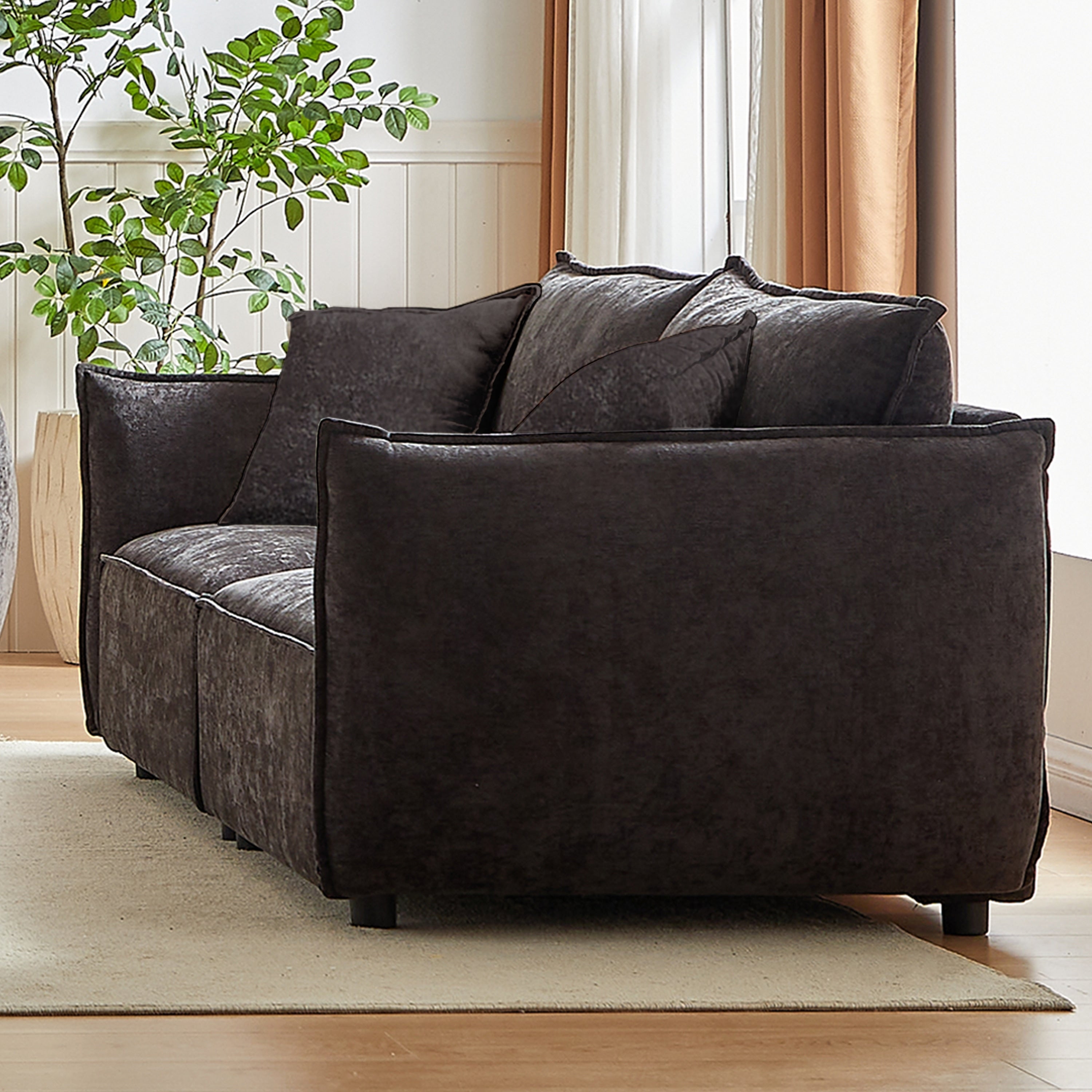 Canapé 3 places en chenille noire avec coussins supplémentaires