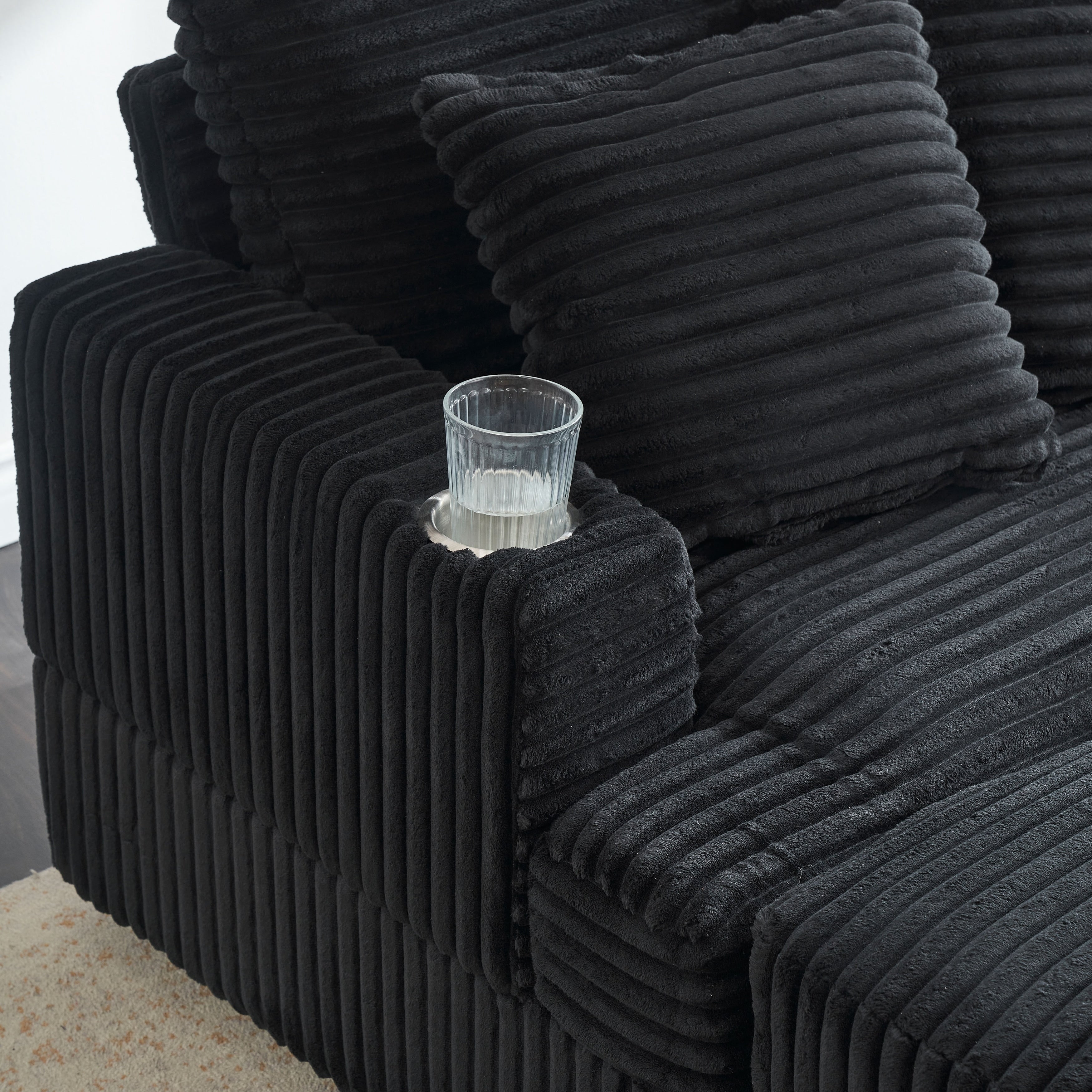 Fauteuil-canapé en velours côtelé noir avec pouf et porte-gobelet