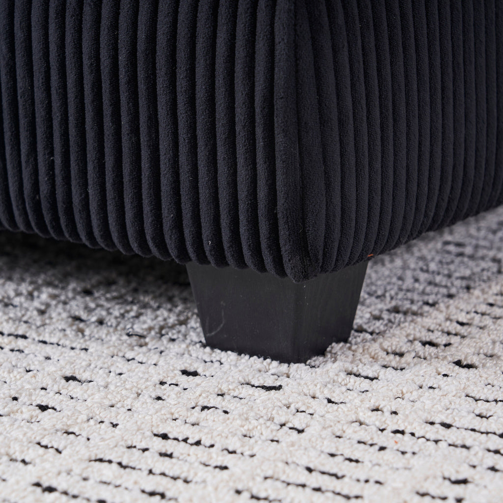 Canapé simple profond en velours côtelé noir avec pouf