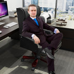 Fauteuil de bureau pivotant ergonomique en similicuir noir avec repose-pieds, dossier capitonné et décoration cloutée