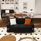 Canapé causeuse moderne en velours noir avec touches dorées et coussins moelleux pour le salon