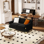 Canapé causeuse moderne en velours noir avec touches dorées et coussins moelleux pour le salon