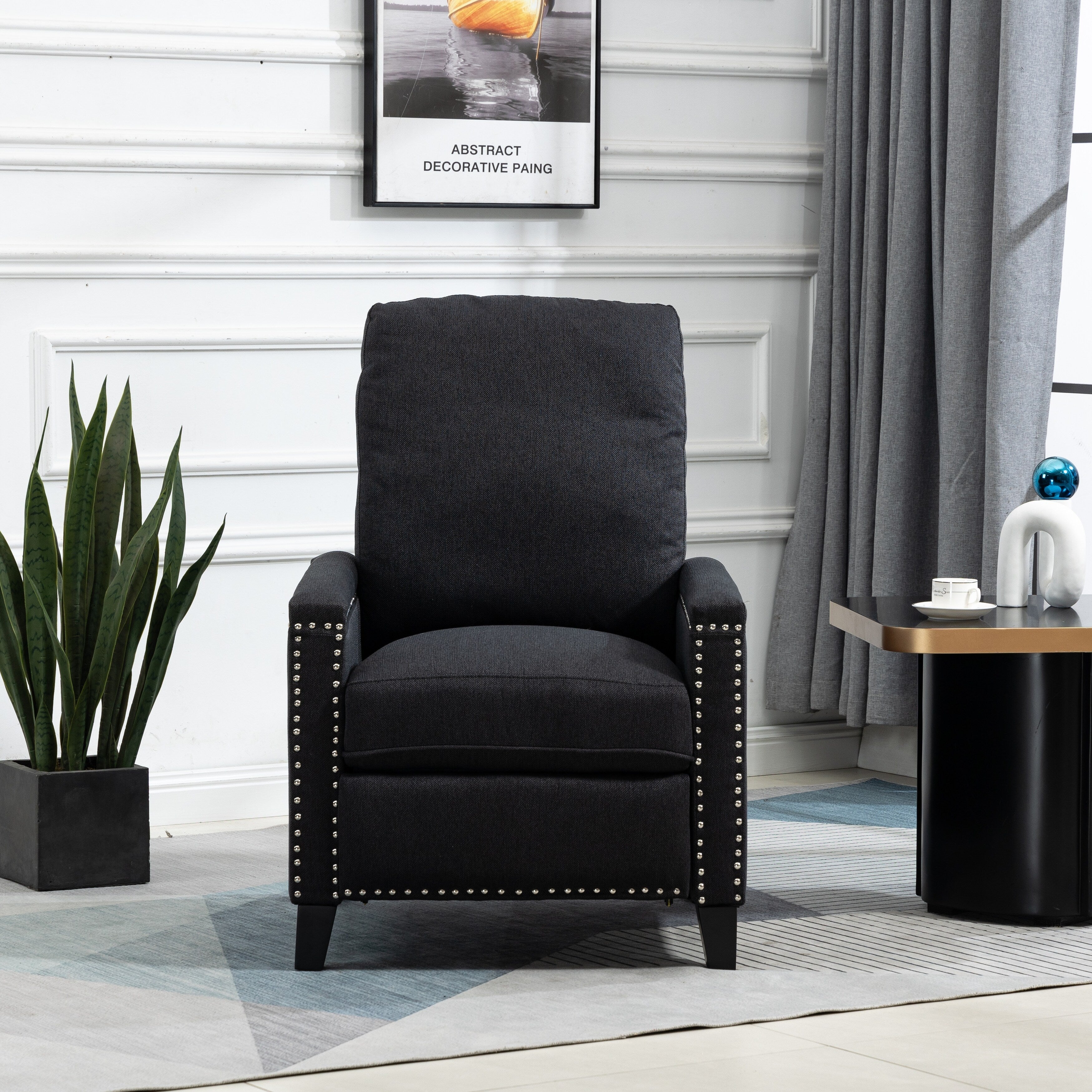 Fauteuil inclinable manuel moderne en velours noir avec coussins et décoration cloutée