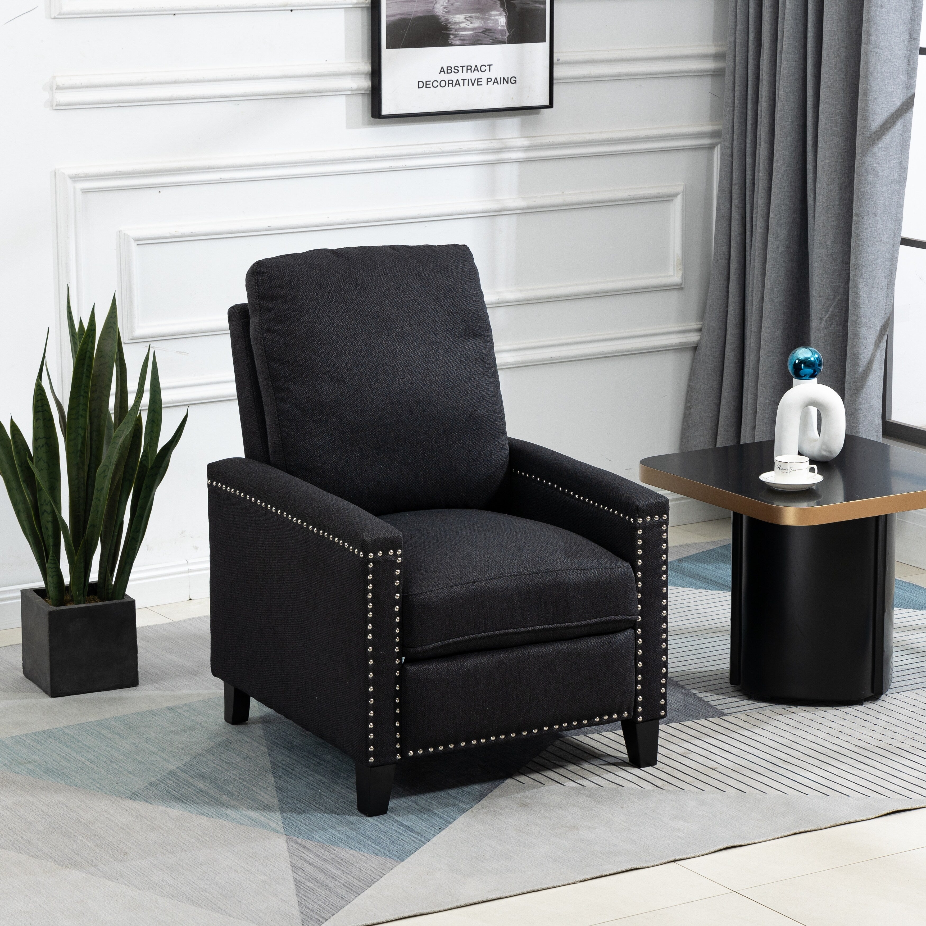 Fauteuil inclinable manuel moderne en velours noir avec coussins et décoration cloutée