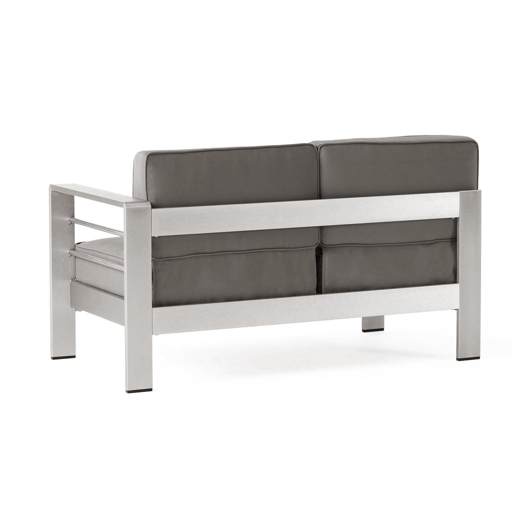 Ensemble de canapés d'extérieur 6 places en aluminium en forme de V avec pouf Cape Coral par Christopher Knight Home