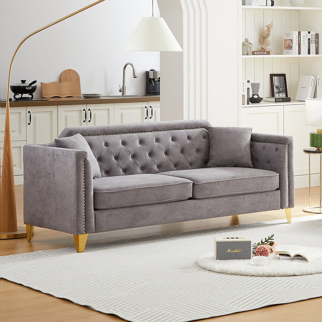 Canapé capitonné 3 places en chenille avec décoration cloutée en cuivre