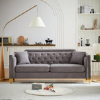 Canapé capitonné 3 places en chenille avec décoration cloutée en cuivre