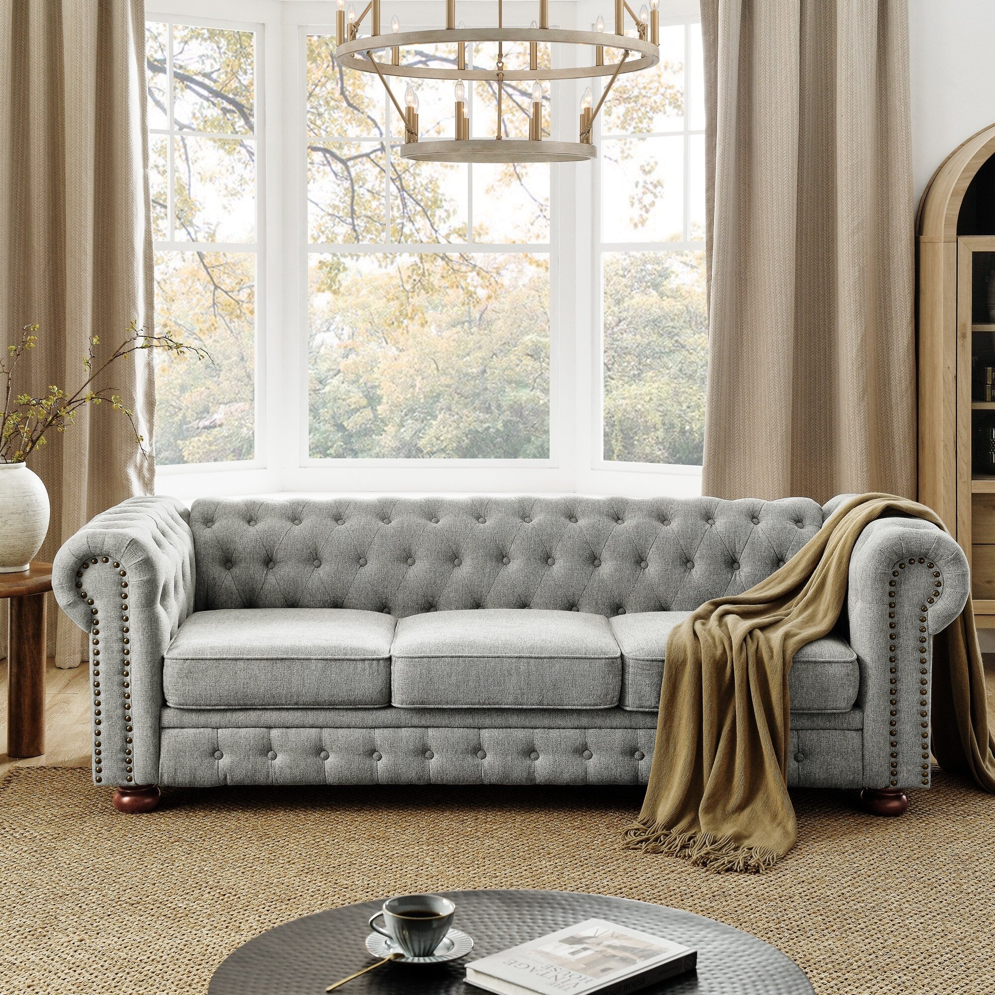 Canapé Chesterfield capitonné 3 places en PU avec accoudoirs à volutes et décoration cloutée