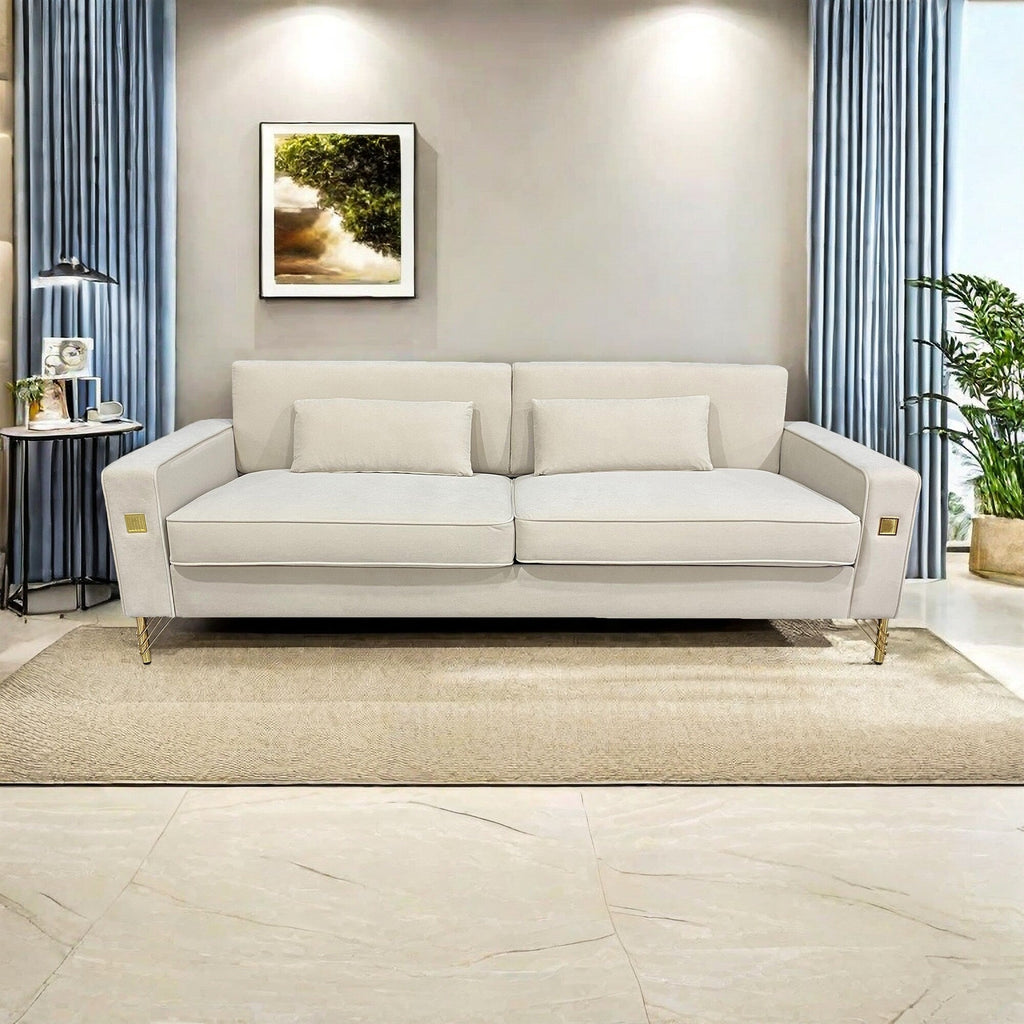 Canapé 3 places en velours blanc crème avec touches dorées