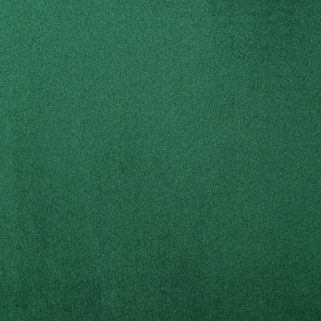 Canapé à oreilles hautes capitonné en velours émeraude