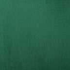 Canapé à oreilles hautes capitonné en velours émeraude