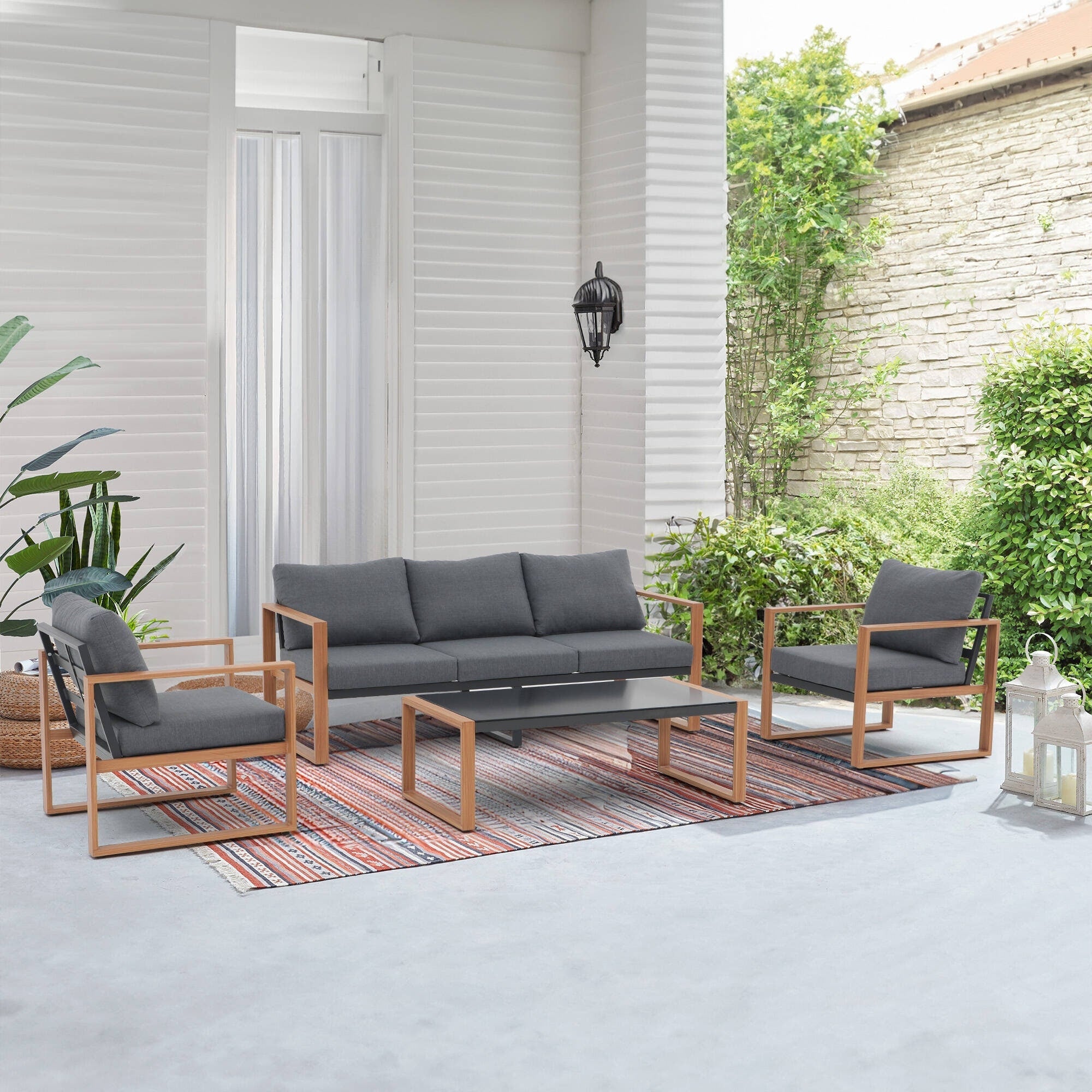 Ensemble de salon de jardin 4 pièces en aluminium gris pour 5 personnes avec coussins et table en verre trempé